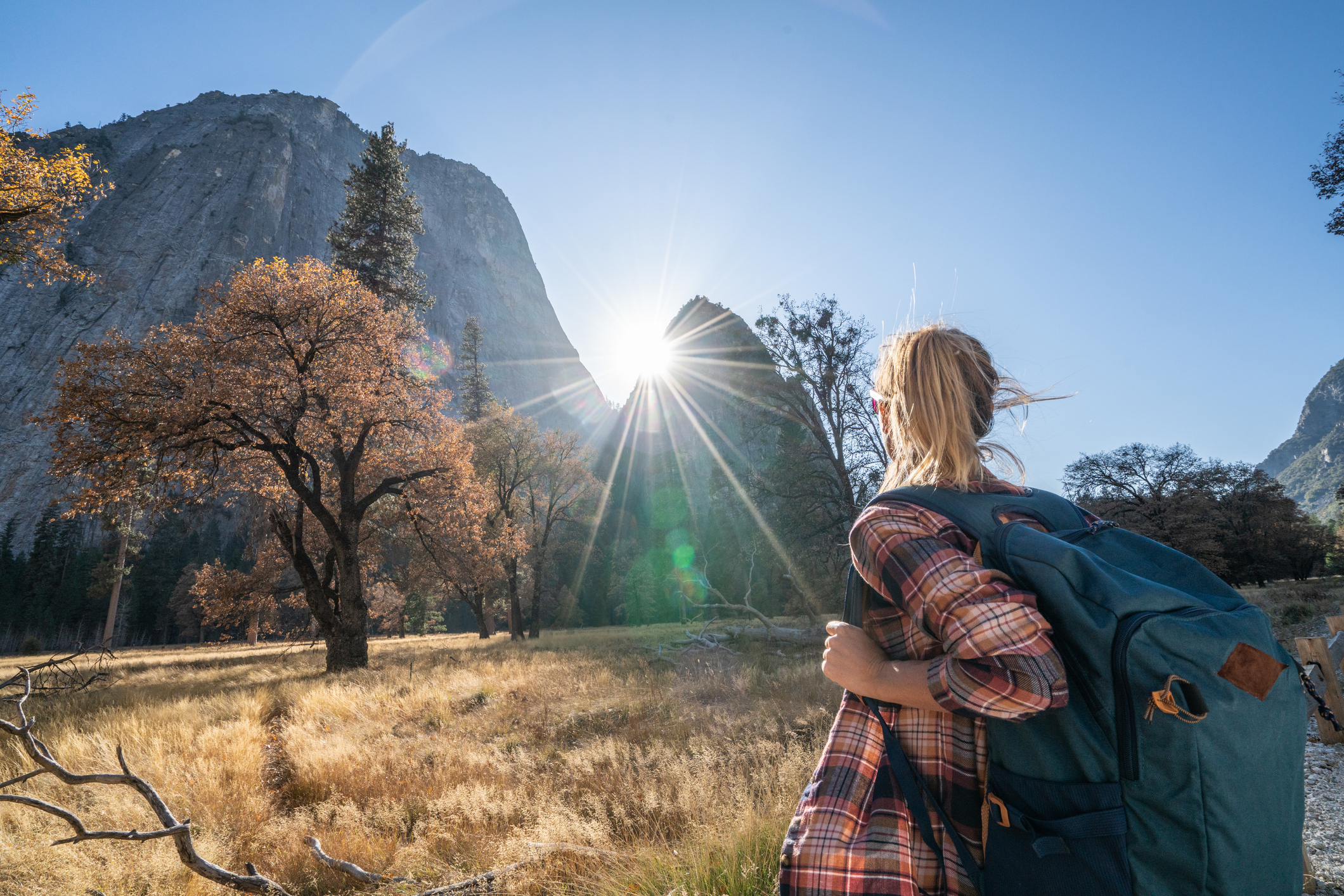 Hiker looking across a scenic mountain landscape